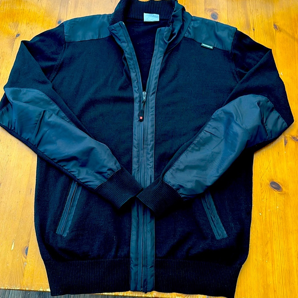 Very light sweater with applications, have the Porsche logo.